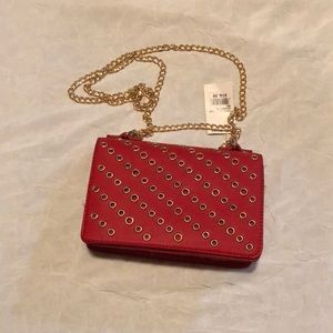 Discovery never used. Red with gold circles.